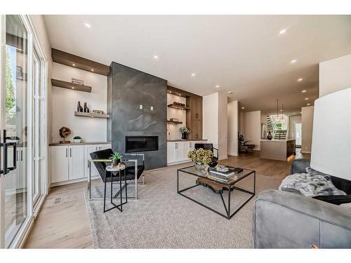 2210 4 Avenue Nw, Calgary, AB - Indoor Photo Showing Living Room With Fireplace