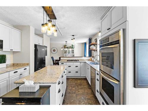 5826 Imperial Drive, Olds, AB - Indoor Photo Showing Kitchen With Double Sink With Upgraded Kitchen