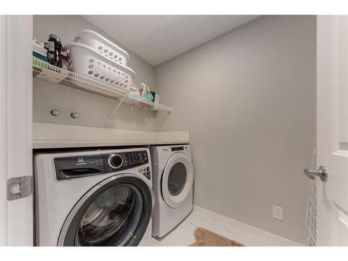 225 Masters Crescent Se, Calgary, AB - Indoor Photo Showing Laundry Room