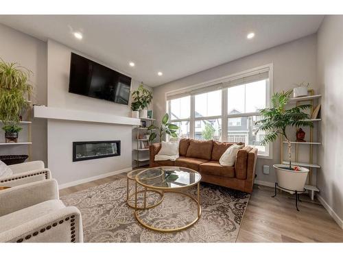 225 Masters Crescent Se, Calgary, AB - Indoor Photo Showing Living Room With Fireplace