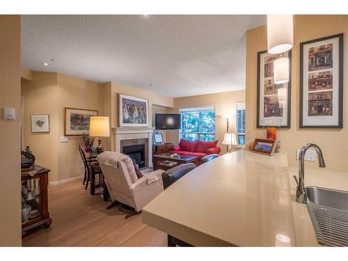 119-2144 Paliswood Road Sw, Calgary, AB - Indoor With Fireplace