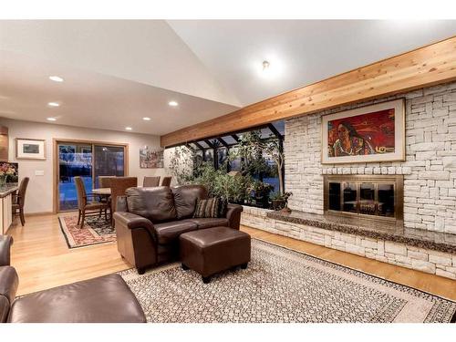 63 Pinebrook Way Sw, Rural Rocky View County, AB - Indoor Photo Showing Living Room With Fireplace