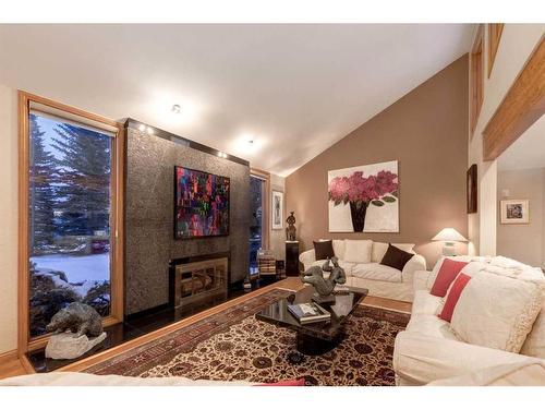 63 Pinebrook Way Sw, Rural Rocky View County, AB - Indoor Photo Showing Living Room With Fireplace