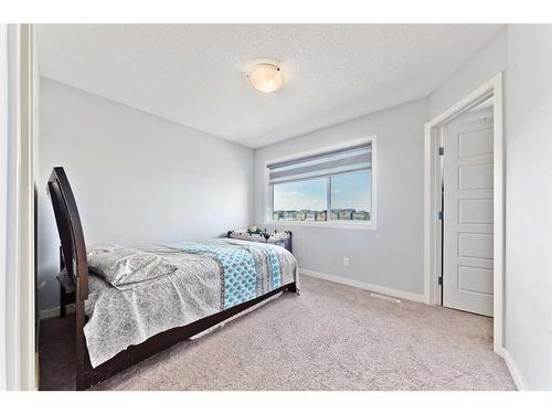 404-70 Saddlestone Drive Ne, Calgary, AB - Indoor Photo Showing Bedroom