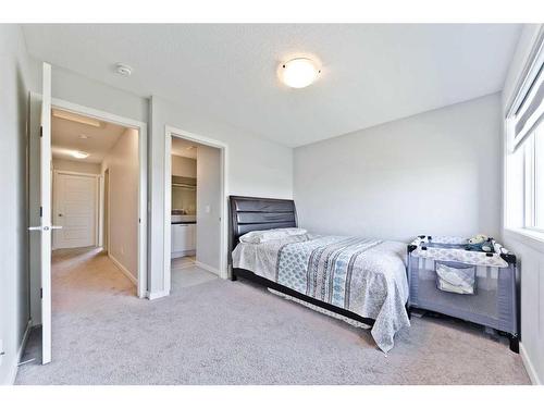 404-70 Saddlestone Drive Ne, Calgary, AB - Indoor Photo Showing Bedroom