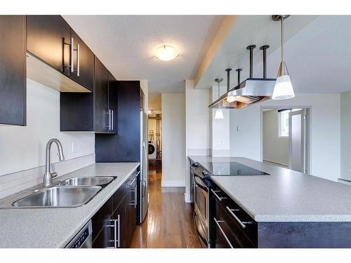 302-505 19 Avenue Sw, Calgary, AB - Indoor Photo Showing Kitchen With Double Sink