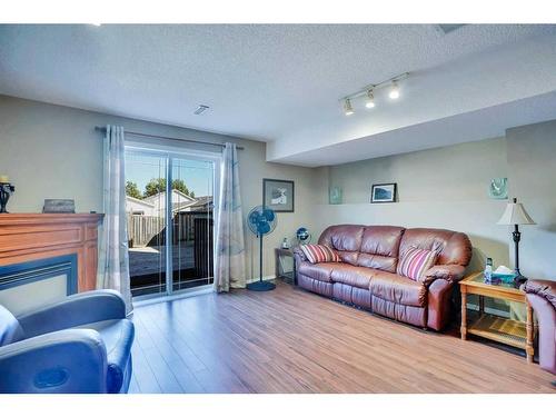 184 Hunterhorn Drive Ne, Calgary, AB - Indoor Photo Showing Living Room With Fireplace