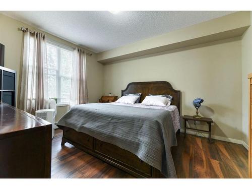 109-1 Crystal Green Lane, Okotoks, AB - Indoor Photo Showing Bedroom