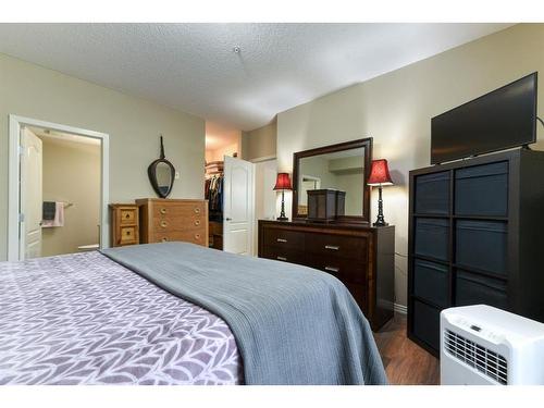 109-1 Crystal Green Lane, Okotoks, AB - Indoor Photo Showing Bedroom