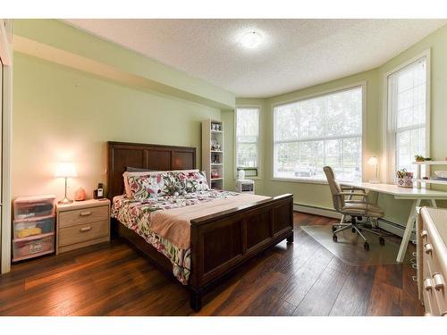 109-1 Crystal Green Lane, Okotoks, AB - Indoor Photo Showing Bedroom