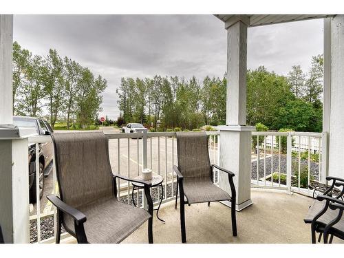 109-1 Crystal Green Lane, Okotoks, AB - Outdoor With Exterior