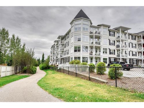 109-1 Crystal Green Lane, Okotoks, AB - Outdoor With Facade