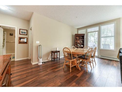 109-1 Crystal Green Lane, Okotoks, AB - Indoor Photo Showing Dining Room