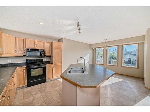 84 Covebrook Close Ne, Calgary, AB - Indoor Photo Showing Kitchen With Double Sink