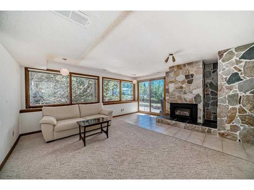 3535 Beaver Road Nw, Calgary, AB - Indoor Photo Showing Living Room With Fireplace