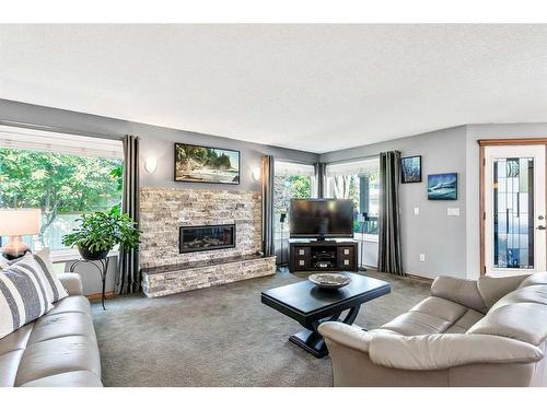 3 Evergreen Close Sw, Calgary, AB - Indoor Photo Showing Living Room With Fireplace