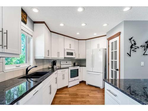 3 Evergreen Close Sw, Calgary, AB - Indoor Photo Showing Kitchen With Double Sink