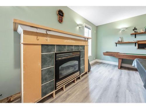 246025 20 Street East, Rural Foothills County, AB - Indoor With Fireplace