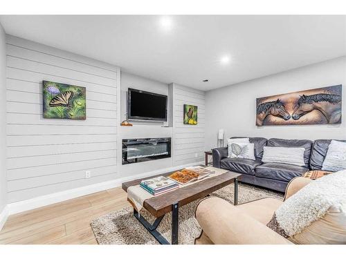 204 Pump Hill View Sw, Calgary, AB - Indoor Photo Showing Living Room With Fireplace