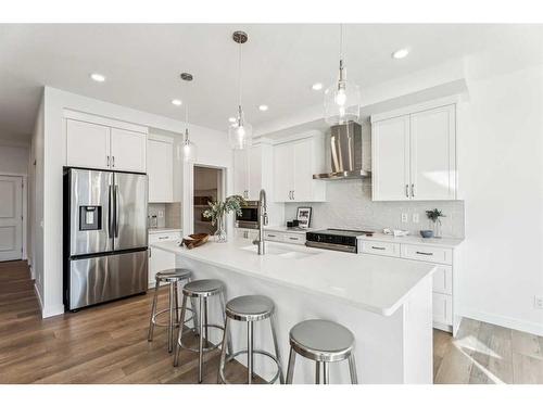 23 Saddlebred Place, Cochrane, AB - Indoor Photo Showing Kitchen With Upgraded Kitchen