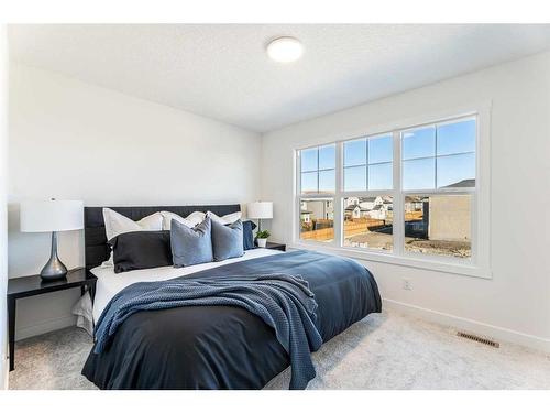 23 Saddlebred Place, Cochrane, AB - Indoor Photo Showing Bedroom