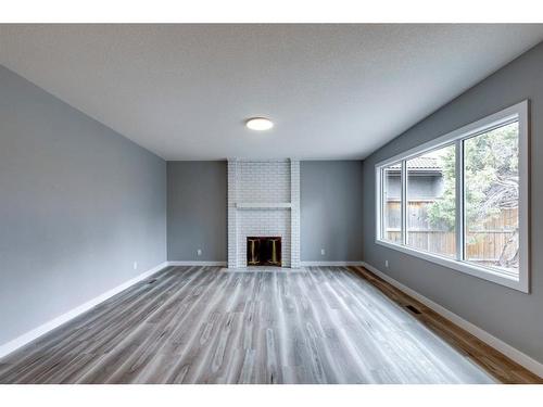 191 Lake Arrow Green Se, Calgary, AB - Indoor Photo Showing Living Room With Fireplace