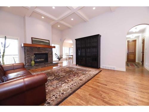 672 Royalite Way, Diamond Valley, AB - Indoor Photo Showing Living Room With Fireplace