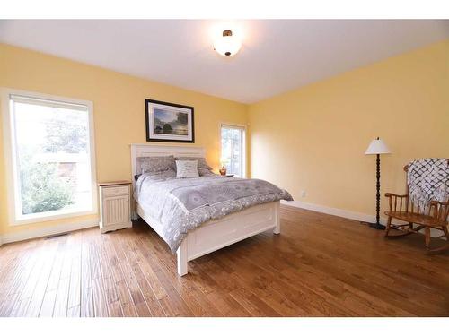 672 Royalite Way, Diamond Valley, AB - Indoor Photo Showing Bedroom