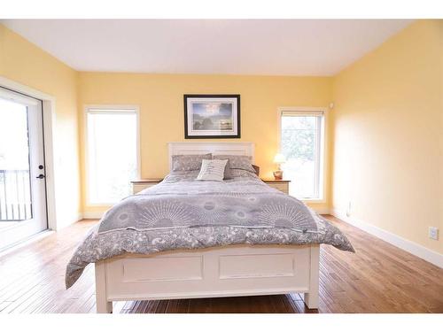 672 Royalite Way, Diamond Valley, AB - Indoor Photo Showing Bedroom