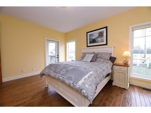 672 Royalite Way, Diamond Valley, AB - Indoor Photo Showing Bedroom