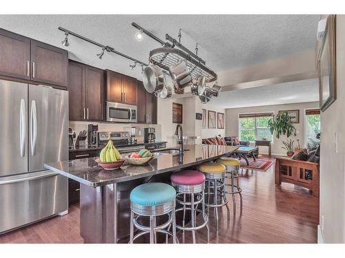 10 Cranford Drive Se, Calgary, AB - Indoor Photo Showing Kitchen With Stainless Steel Kitchen With Upgraded Kitchen