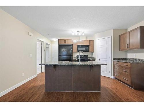 11201-2781 Chinook Winds Drive Sw, Airdrie, AB - Indoor Photo Showing Kitchen