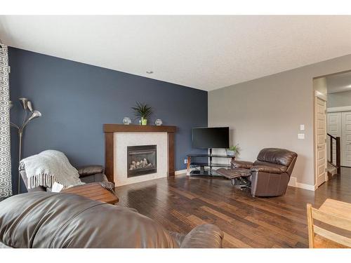 1611 Monteith Drive Se Drive, High River, AB - Indoor Photo Showing Living Room With Fireplace