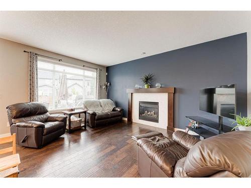 1611 Monteith Drive Se Drive, High River, AB - Indoor Photo Showing Living Room With Fireplace