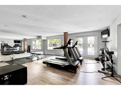 113-35 Richard Court Sw, Calgary, AB - Indoor Photo Showing Gym Room