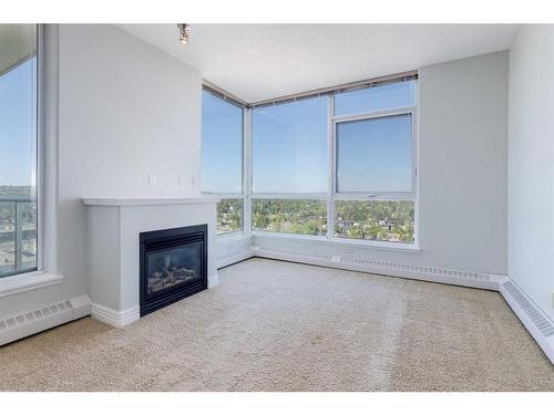 1507-55 Spruce Place Sw, Calgary, AB - Indoor Photo Showing Other Room With Fireplace