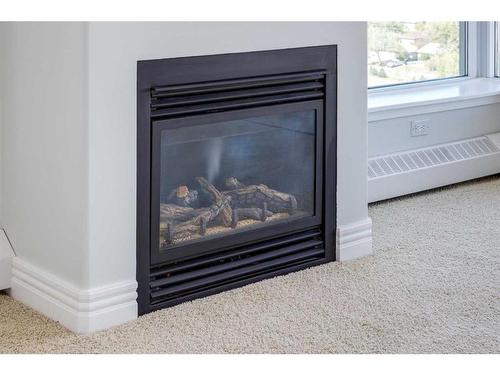 1507-55 Spruce Place Sw, Calgary, AB - Indoor Photo Showing Living Room With Fireplace