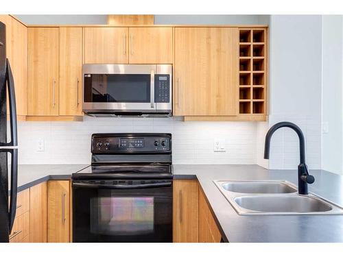 1507-55 Spruce Place Sw, Calgary, AB - Indoor Photo Showing Kitchen With Double Sink