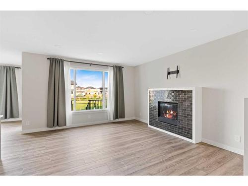 176 Sandpiper Landing, Chestermere, AB - Indoor Photo Showing Living Room With Fireplace