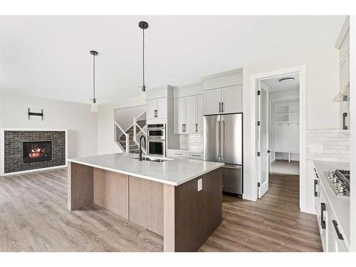 176 Sandpiper Landing, Chestermere, AB - Indoor Photo Showing Kitchen With Stainless Steel Kitchen With Upgraded Kitchen