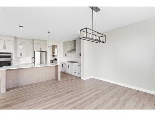 176 Sandpiper Landing, Chestermere, AB - Indoor Photo Showing Kitchen With Upgraded Kitchen