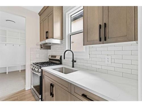 176 Sandpiper Landing, Chestermere, AB - Indoor Photo Showing Kitchen With Double Sink With Upgraded Kitchen