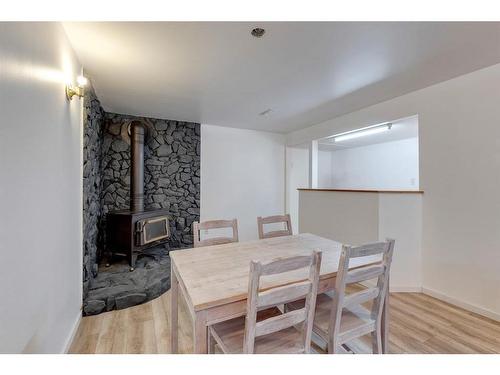 96 Pensacola Close Se, Calgary, AB - Indoor Photo Showing Dining Room With Fireplace