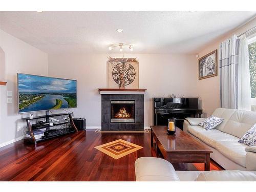 356 Windermere Drive, Chestermere, AB - Indoor Photo Showing Living Room With Fireplace