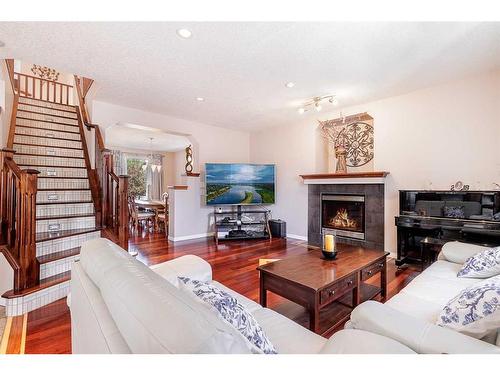 356 Windermere Drive, Chestermere, AB - Indoor Photo Showing Living Room With Fireplace