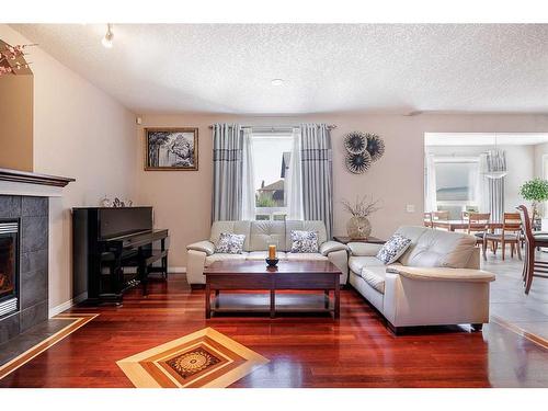 356 Windermere Drive, Chestermere, AB - Indoor Photo Showing Living Room With Fireplace