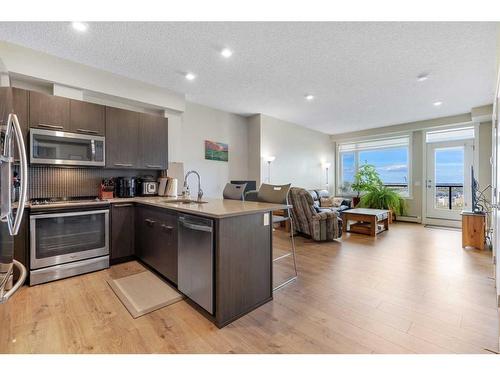 413-214 Sherwood Square Nw, Calgary, AB - Indoor Photo Showing Kitchen With Stainless Steel Kitchen