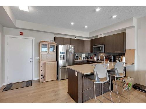 413-214 Sherwood Square Nw, Calgary, AB - Indoor Photo Showing Kitchen With Stainless Steel Kitchen