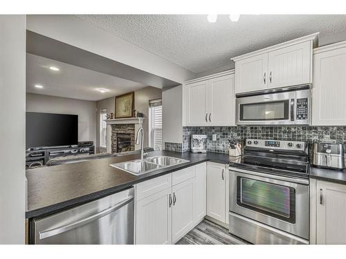 44 Sage Valley Drive Nw, Calgary, AB - Indoor Photo Showing Kitchen With Stainless Steel Kitchen With Double Sink