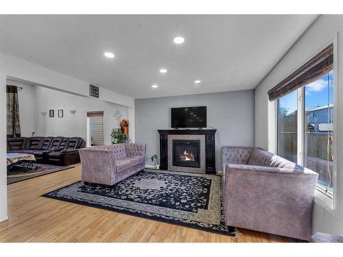 845 Luxstone Square Sw, Airdrie, AB - Indoor Photo Showing Living Room With Fireplace